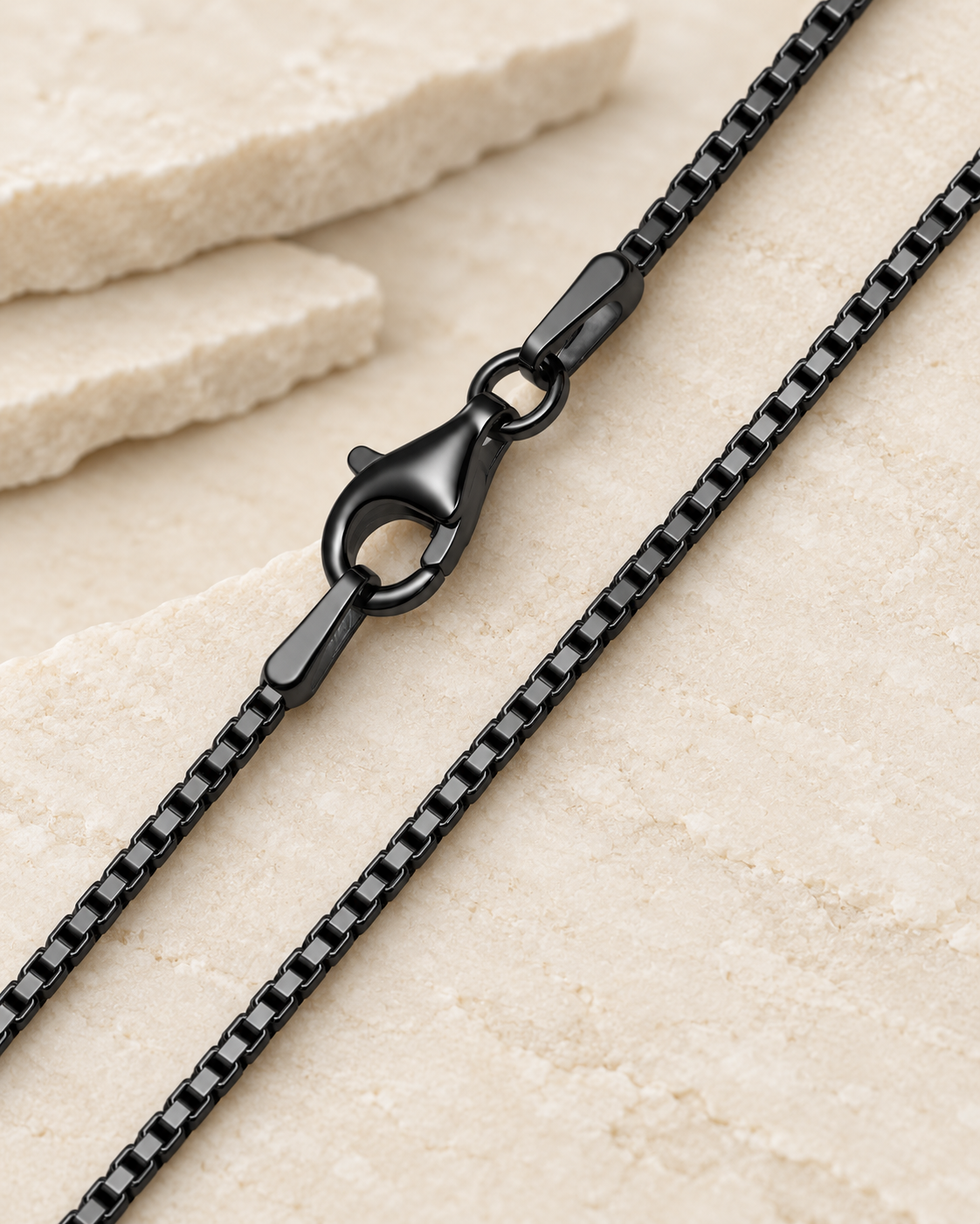 30 inch black premium box chain with lobster clasp on cream stone.