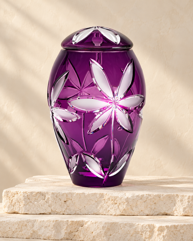 Purple Flowers cremation urn on stacked cream stone.