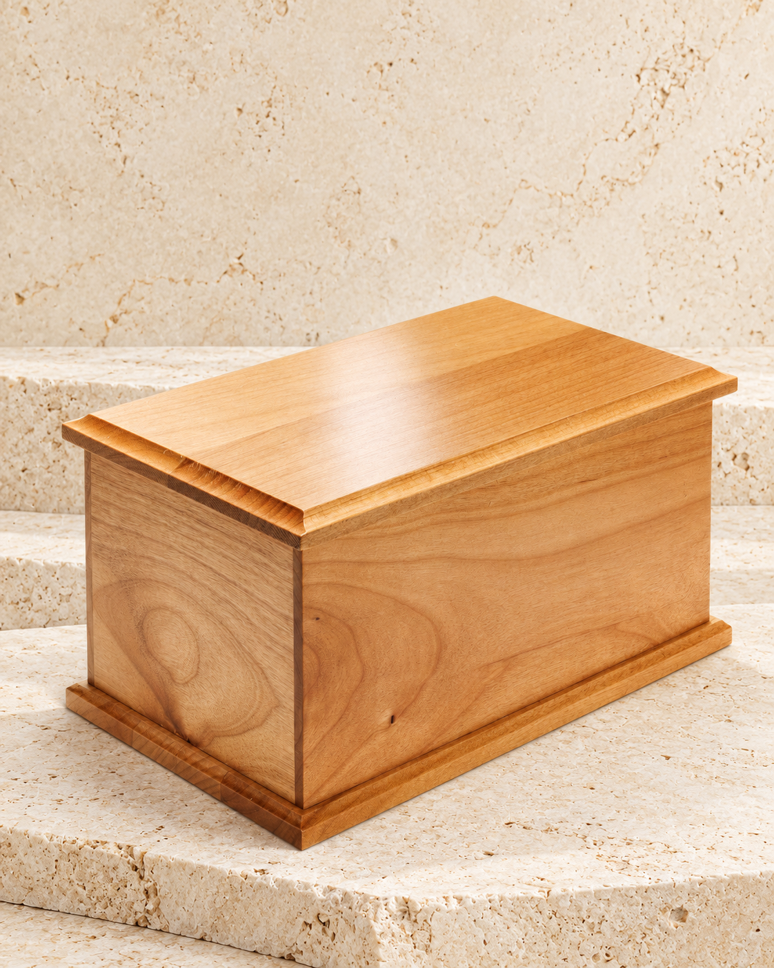 extra large alder cremation urn on cream stacked stone, portrait product photograph
