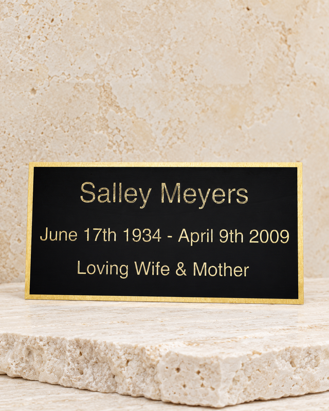 large phoenix engraved plate on cream stacked stone, portrait product photograph