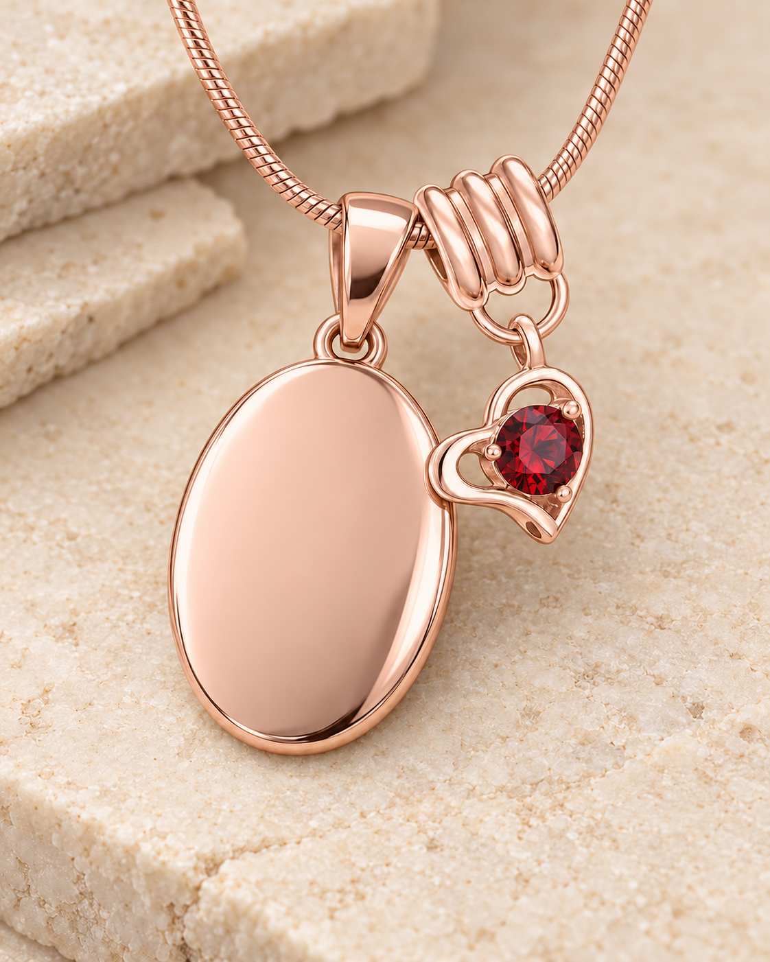 January rose gold birthstone heart hanger with an illustrative matching oval pendant; display pendant and chain sold separately.