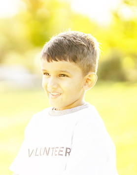 A child in an overexposed photo with bright highlights