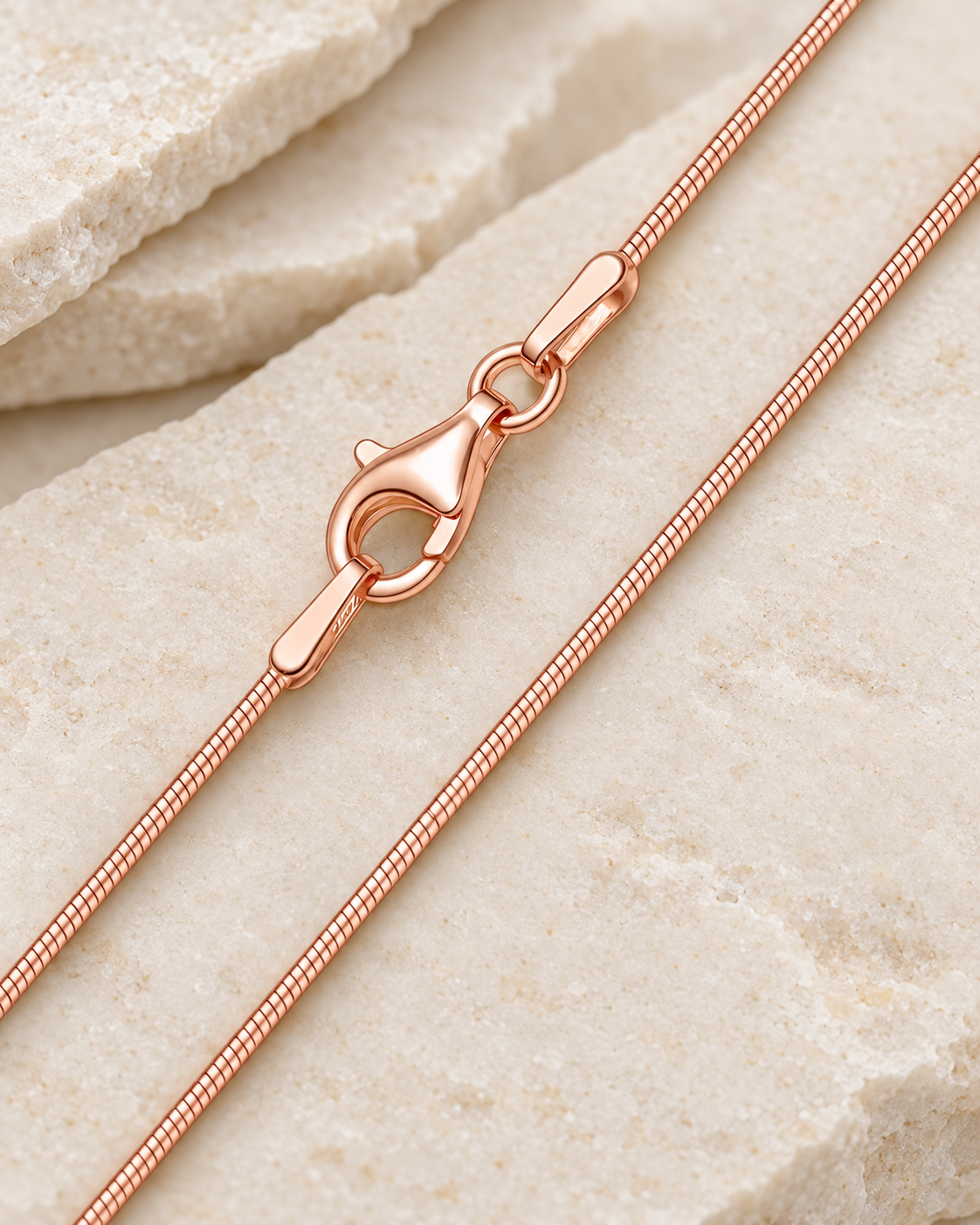 20 inch rose gold stainless steel snake chain with lobster clasp.