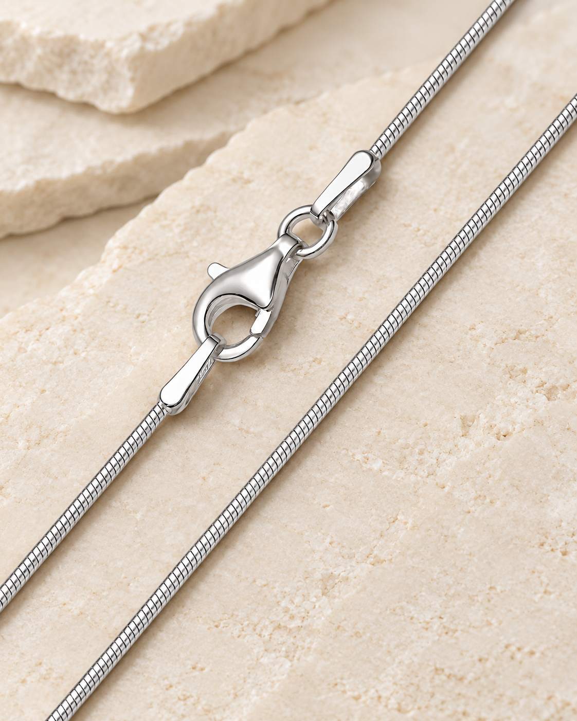 20 inch silver stainless steel snake chain with lobster clasp.