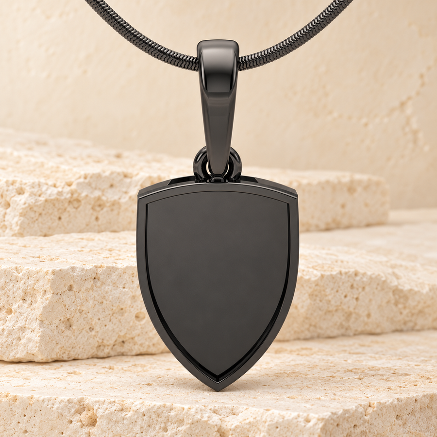 Black Shield Me Forever Sealed necklace on cream stone.