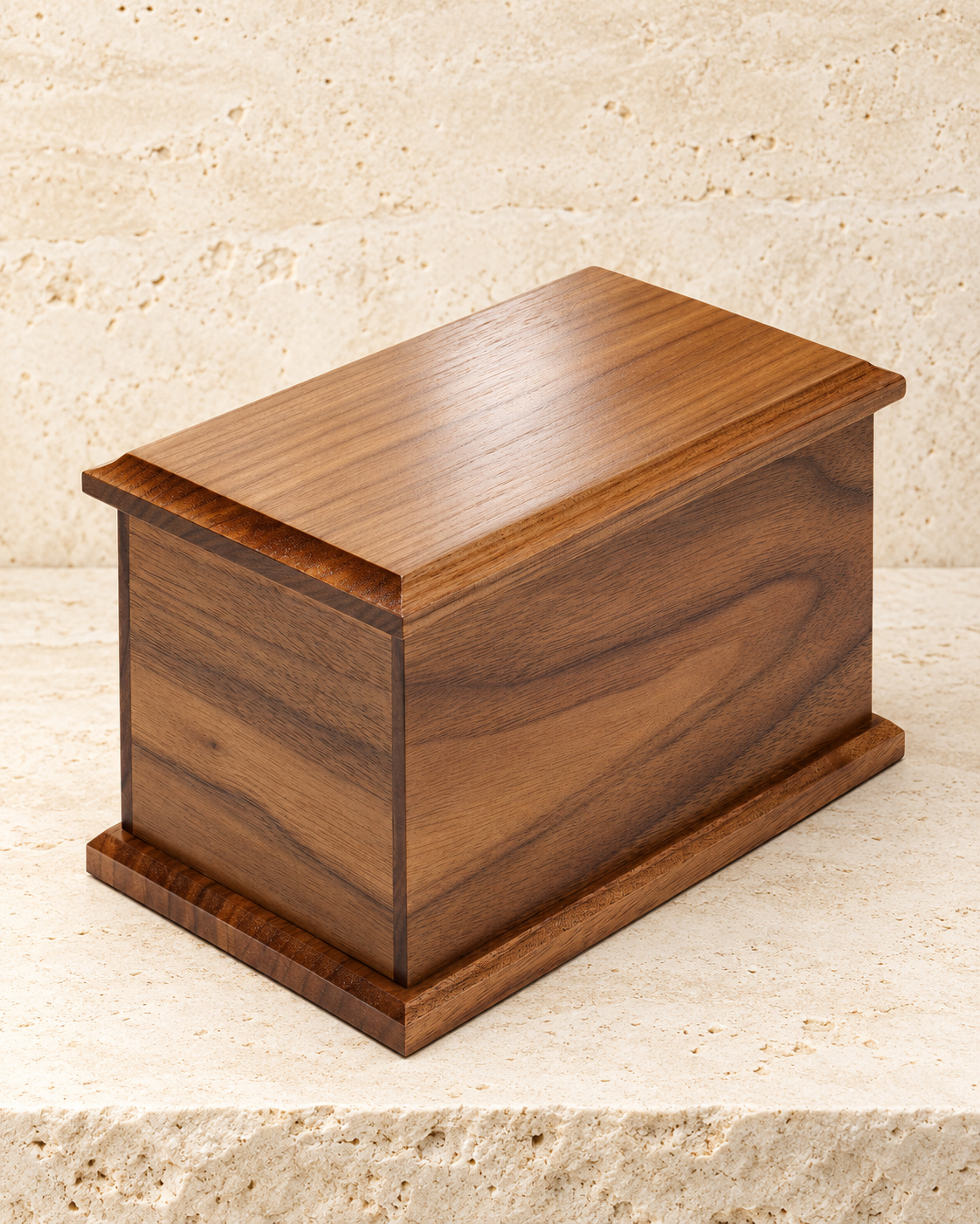 large walnut cremation urn on cream stacked stone, portrait product photograph