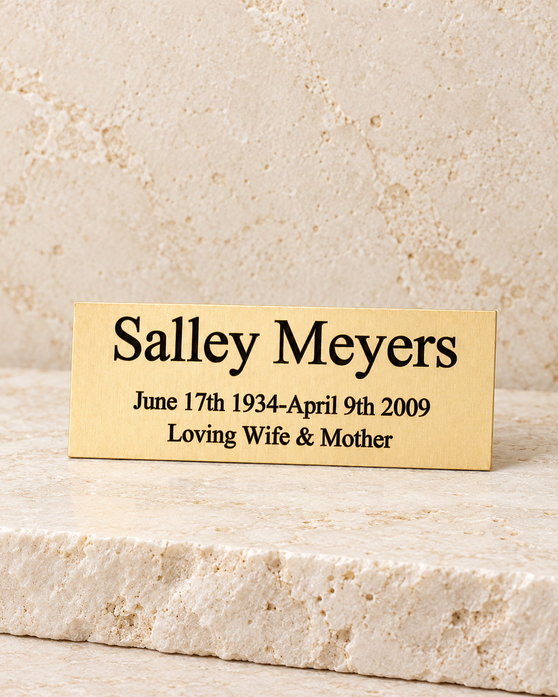 small aquarius engraved plate on cream stacked stone, portrait product photograph