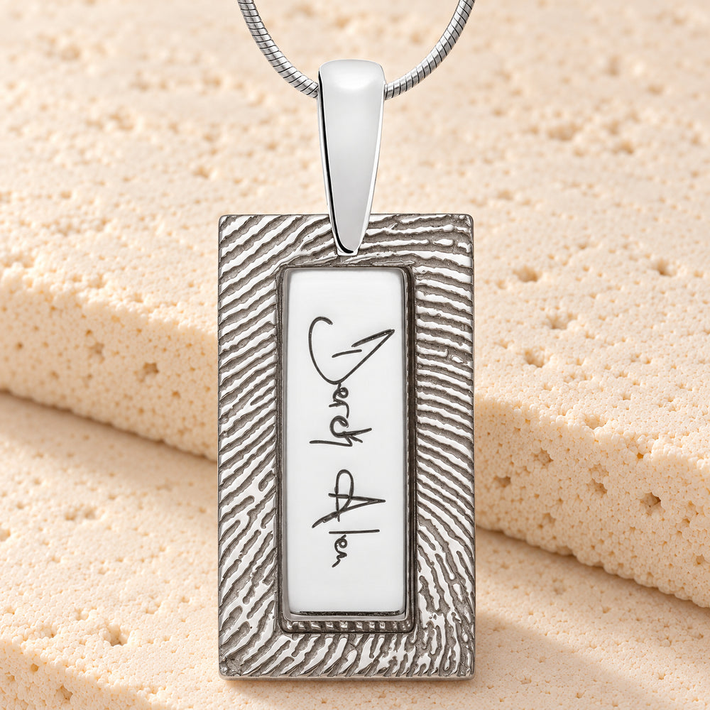 Sterling silver signature rectangle necklace with original chain on cream stone