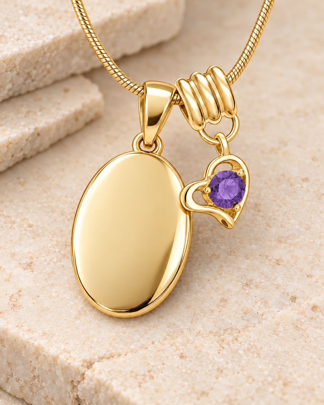 February gold birthstone heart hanger with an illustrative matching oval pendant; display pendant and chain sold separately.